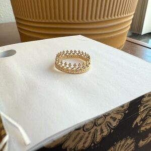 Size 5.5 14k gold crown ring. Small flaw where it was resized.